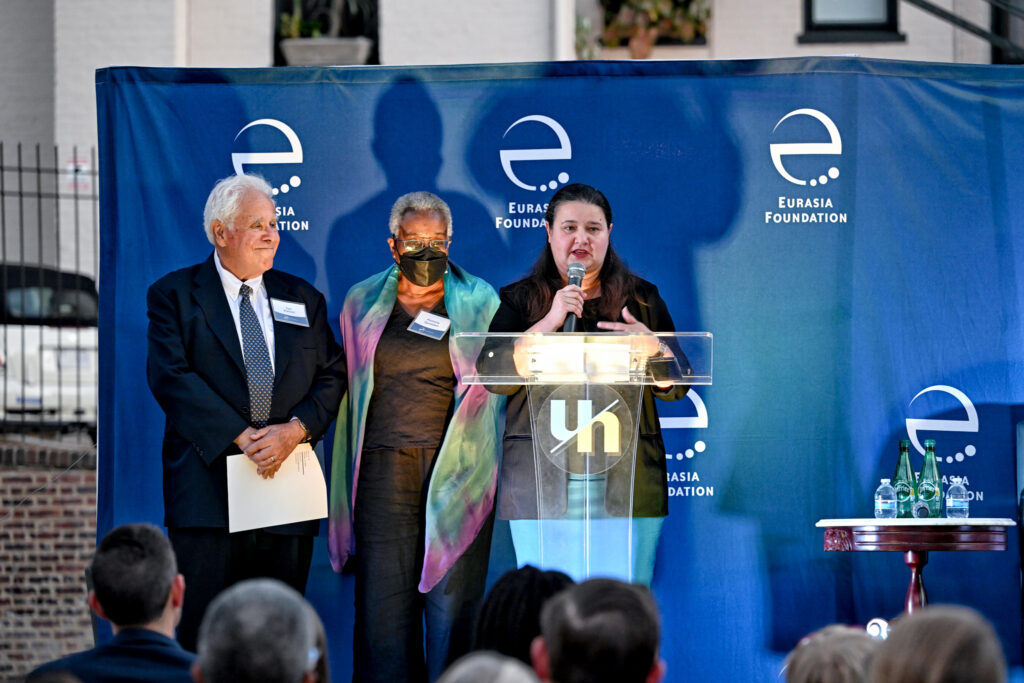 Ambassador Markarova addresses the audience. She stands at a podium in front of a large blue backdrop featuring Eurasia Foundation's logo.