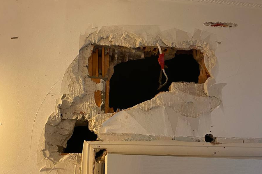 Another angle of the large hole in Andrii's wall caused by shelling